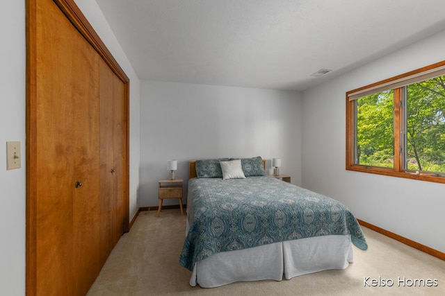 766 Clarewood Ct, Holland, MI 49423 - carpeted bedroom featuring baseboards and a closet