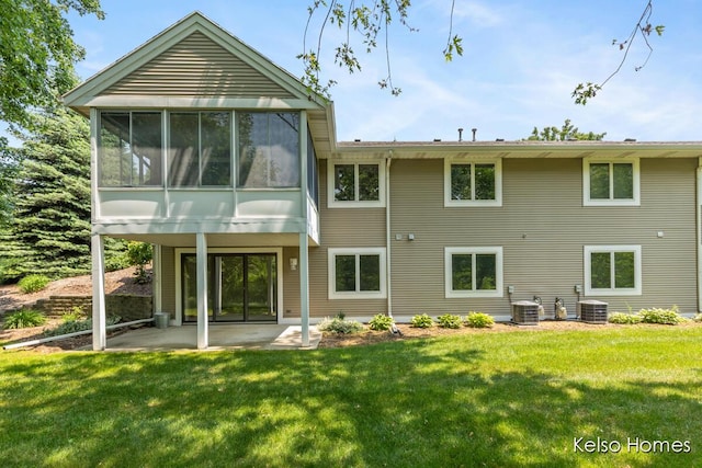766 Clarewood Ct, Holland, MI 49423 - rear view of house with a patio, a lawn, and a sunroom