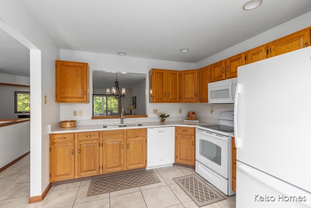 766 Clarewood Ct, Holland, MI 49423 - kitchen featuring white appliances, light countertops, light tile patterned floors, a chandelier, and brown cabinetry