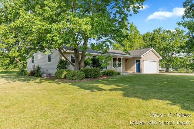 10829 26th Ave NW, Grand Rapids, MI 49534 - view of front of property featuring a garage, a front yard, and driveway