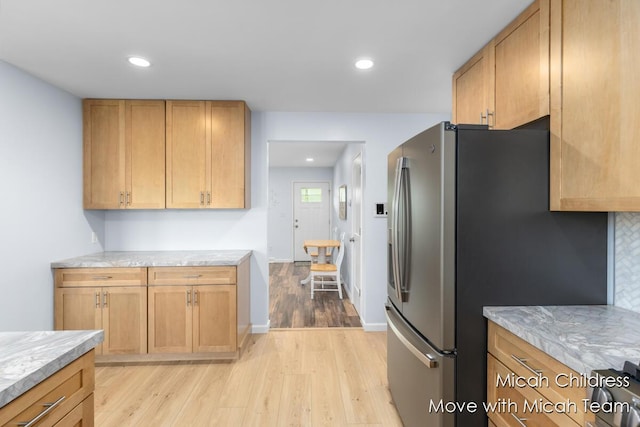10829 26th Ave NW, Grand Rapids, MI 49534 - kitchen with light wood-style flooring, freestanding refrigerator, recessed lighting, and stove