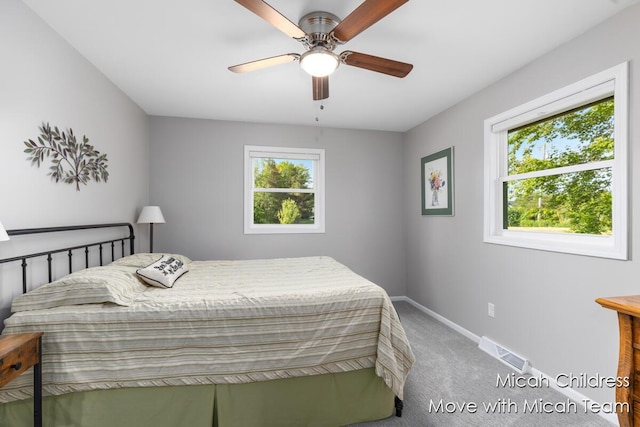 10829 26th Ave NW, Grand Rapids, MI 49534 - carpeted bedroom featuring baseboards and a ceiling fan