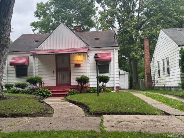 18482 Braile St, Detroit, MI 48219 - bungalow-style home featuring board and batten siding and a chimney