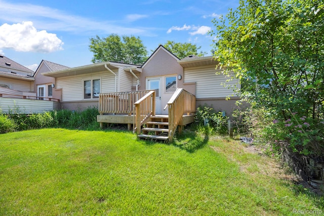 29680 Olympia Ct, Farmington Hills, MI 48336 - back of house featuring a wooden deck and a lawn