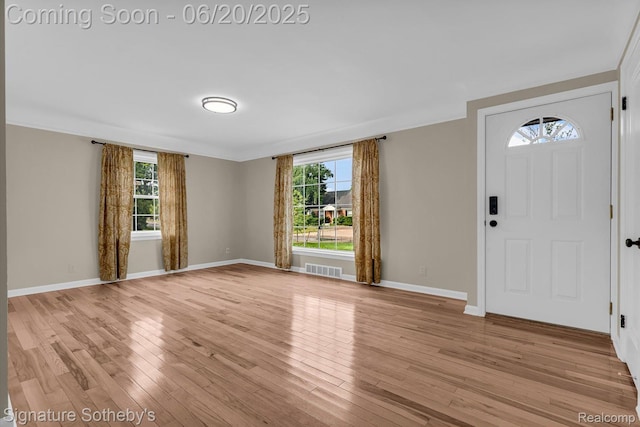 1717 Penistone St, Lake Orion, MI 48009 - entrance foyer with light wood finished floors and crown molding