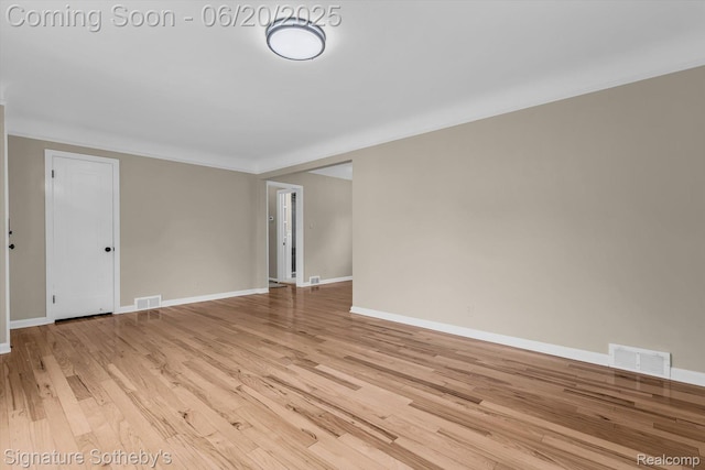 1717 Penistone St, Lake Orion, MI 48009 - empty room with light wood-style flooring and crown molding