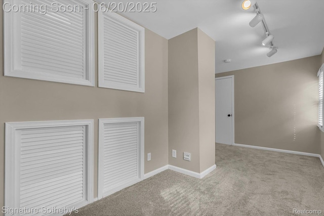 1717 Penistone St, Lake Orion, MI 48009 - spare room featuring carpet, track lighting, and a smoke detector