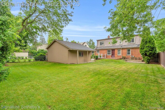 1717 Penistone St, Lake Orion, MI 48009 - fenced backyard featuring an outdoor structure