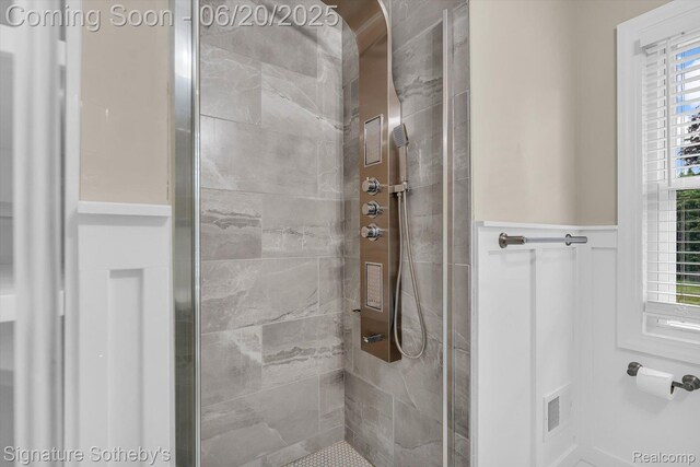 1717 Penistone St, Lake Orion, MI 48009 - full bath with a stall shower and a wainscoted wall