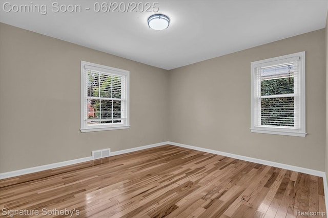 1717 Penistone St, Lake Orion, MI 48009 - unfurnished room with wood finished floors and baseboards