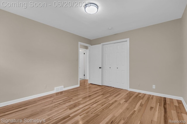 1717 Penistone St, Lake Orion, MI 48009 - unfurnished bedroom featuring light wood finished floors and a closet