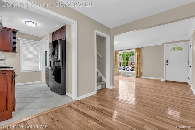 1717 Penistone St, Lake Orion, MI 48009 - entrance foyer featuring stairs and light wood finished floors