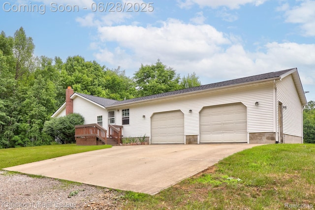 6275 Caine Rd, Vassar, MI 48768 - view of front of house with a front lawn, driveway, a deck, and an attached garage