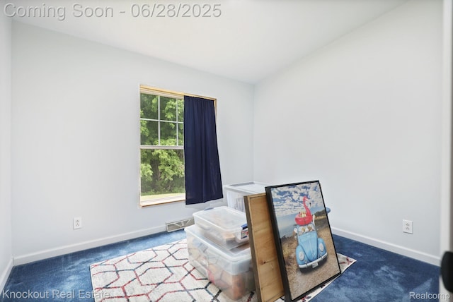 6275 Caine Rd, Vassar, MI 48768 - interior space featuring dark colored carpet and baseboards
