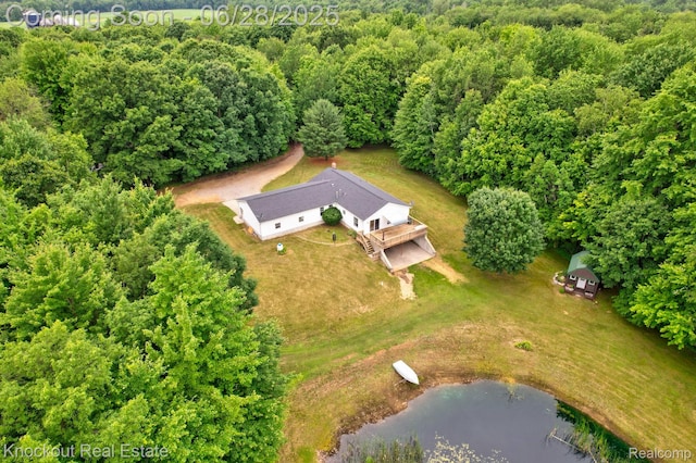 6275 Caine Rd, Vassar, MI 48768 - view of subject property featuring a large body of water and a forest