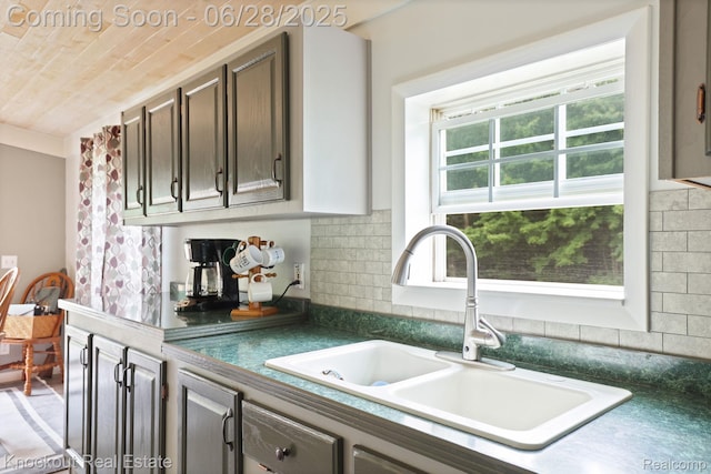 6275 Caine Rd, Vassar, MI 48768 - kitchen featuring dark countertops and tasteful backsplash
