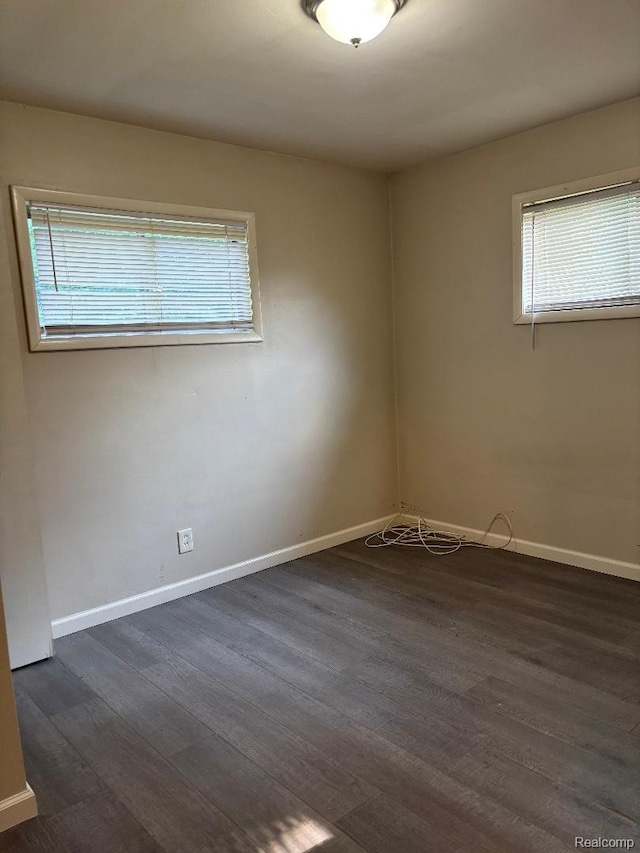 31612 Antrim Ct, Westland, MI 48186 - empty room featuring dark wood finished floors and baseboards