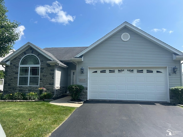 2118 Fountain Cir, Lambertville, MI 48144 - ranch-style house with stone siding, asphalt driveway, a garage, a front lawn, and roof with shingles