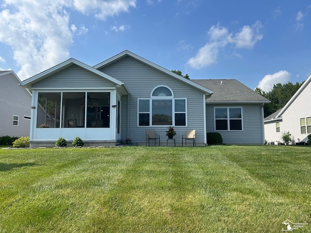 2118 Fountain Cir, Lambertville, MI 48144 - rear view of property featuring a lawn, a sunroom, and a shingled roof