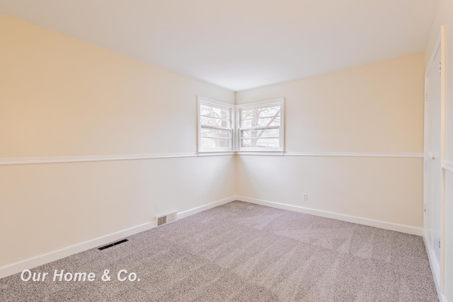 1716 Sycamore St, Saginaw, MI 48602 - carpeted empty room featuring baseboards