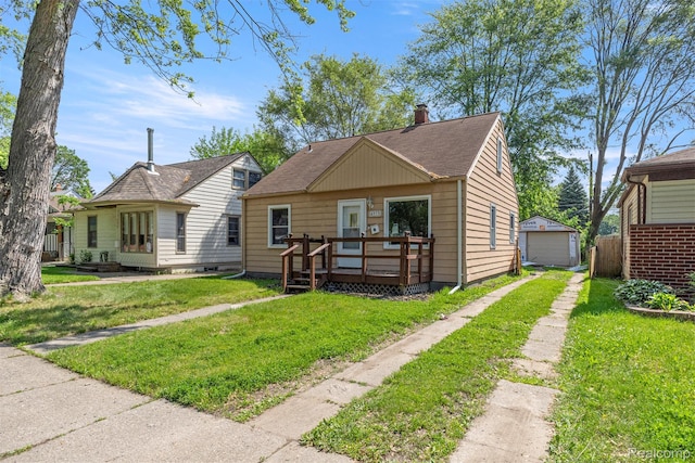 4933 Ziegler St, Dearborn Heights, MI 48125 - bungalow-style home with driveway, a deck, a garage, a front lawn, and a chimney