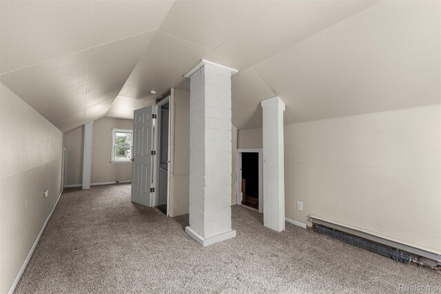 4933 Ziegler St, Dearborn Heights, MI 48125 - bonus room with carpet floors, lofted ceiling, a baseboard heating unit, and ornate columns