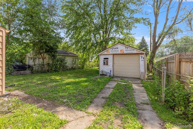 4933 Ziegler St, Dearborn Heights, MI 48125 - view of yard featuring driveway, an outdoor structure, and a garage