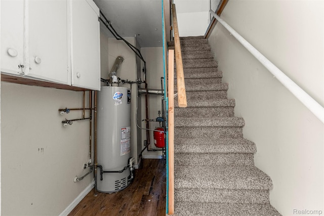 4933 Ziegler St, Dearborn Heights, MI 48125 - stairway with gas water heater and wood finished floors