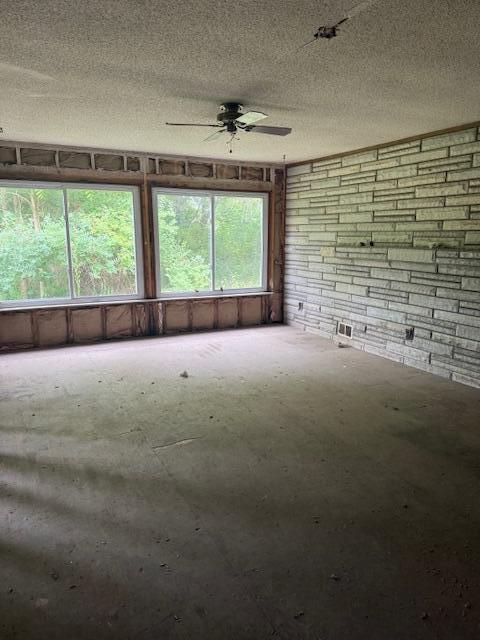 3903 Willow Dr NE, Grand Rapids, MI 49525 - unfurnished room with ceiling fan and a textured ceiling