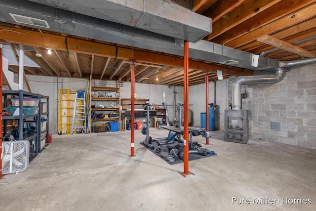 8651 22 Mile Rd NE, Sand Lake, MI 49343 - unfinished basement featuring a water pressure tank