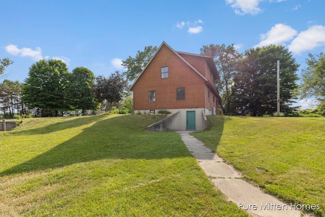 8651 22 Mile Rd NE, Sand Lake, MI 49343 - view of home's exterior with a lawn