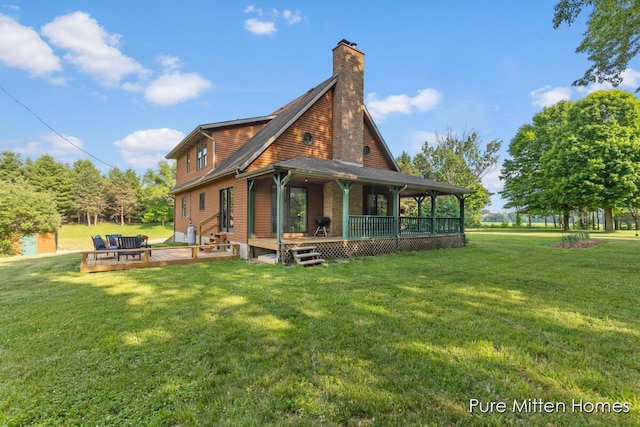 8651 22 Mile Rd NE, Sand Lake, MI 49343 - rear view of property with a yard and a chimney