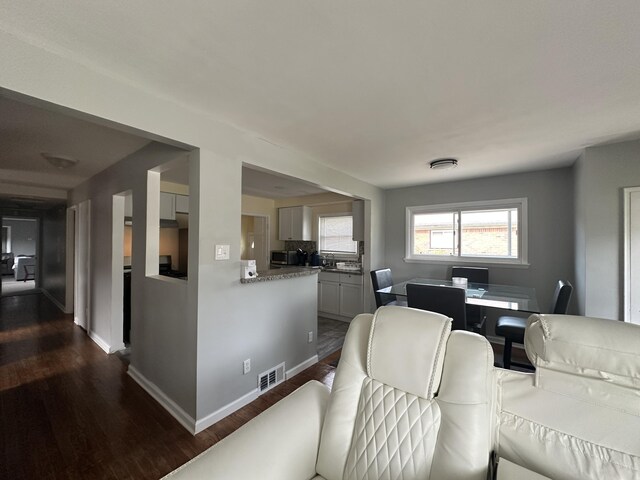 29635 Julius Blvd, Westland, MI 48186 - living room featuring dark wood-style flooring and baseboards