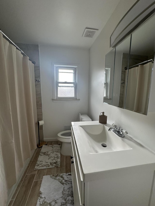 29635 Julius Blvd, Westland, MI 48186 - full bathroom featuring vanity, a shower with curtain, and wood finish floors