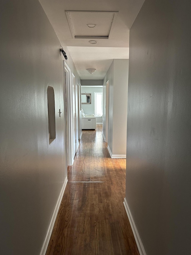 29635 Julius Blvd, Westland, MI 48186 - hallway featuring wood finished floors, attic access, and arched walkways