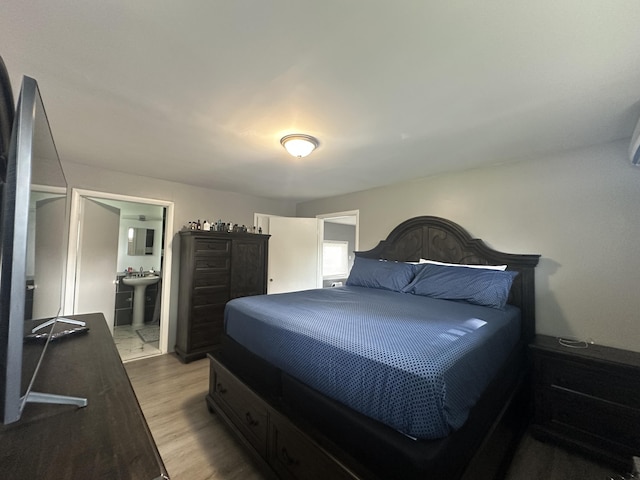 29635 Julius Blvd, Westland, MI 48186 - bedroom with light wood-style floors and ensuite bathroom