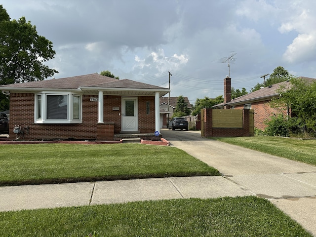 29635 Julius Blvd, Westland, MI 48186 - bungalow-style house featuring brick siding, a front lawn, concrete driveway, and roof with shingles