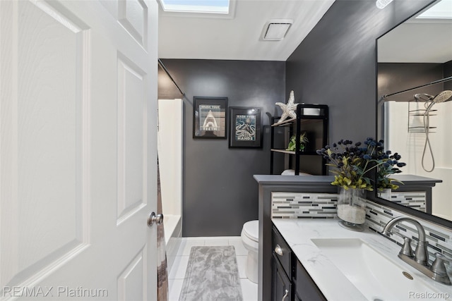 13368 N Fenton Rd, Fenton, MI 48430 - full bath with vanity, shower / bath combination with curtain, tile patterned flooring, and tasteful backsplash