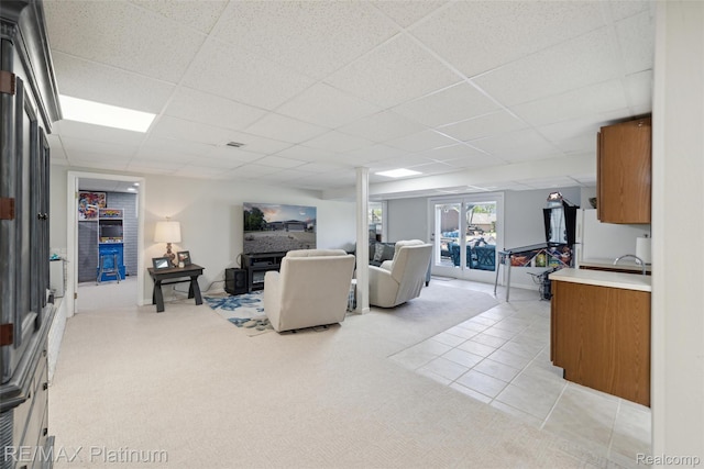 13368 N Fenton Rd, Fenton, MI 48430 - living area featuring a drop ceiling, light tile patterned floors, and light colored carpet