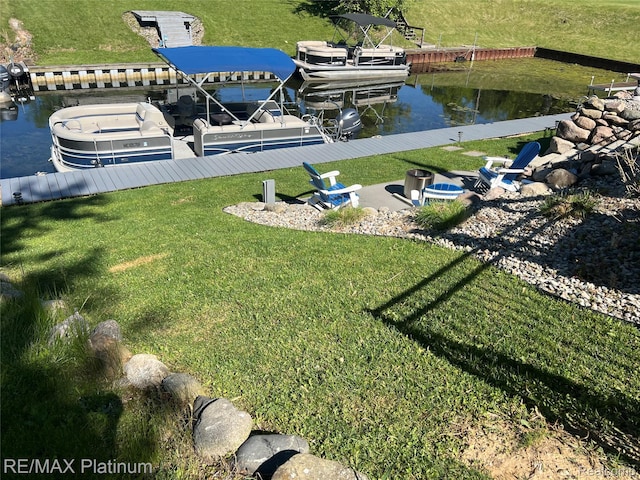 13368 N Fenton Rd, Fenton, MI 48430 - view of grassy yard with a boat dock and a water view