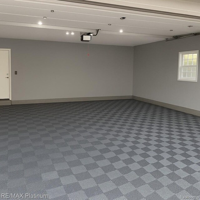 13368 N Fenton Rd, Fenton, MI 48430 - garage with baseboards and a garage door opener