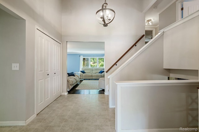 47470 Barbara Rd, Macomb, MI 48044 - foyer featuring baseboards and a chandelier