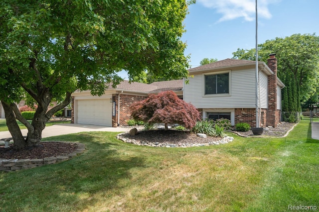 47470 Barbara Rd, Macomb, MI 48044 - split level home with a chimney, an attached garage, brick siding, and a front yard