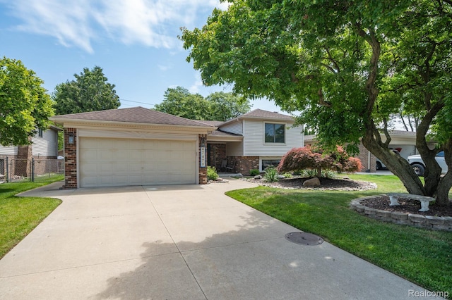47470 Barbara Rd, Macomb, MI 48044 - split level home with brick siding, an attached garage, and driveway