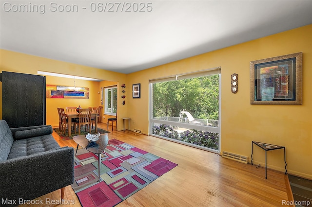 7189 Lindenmere Dr, Bloomfield Hills, MI 48301 - living room with a chandelier and wood finished floors