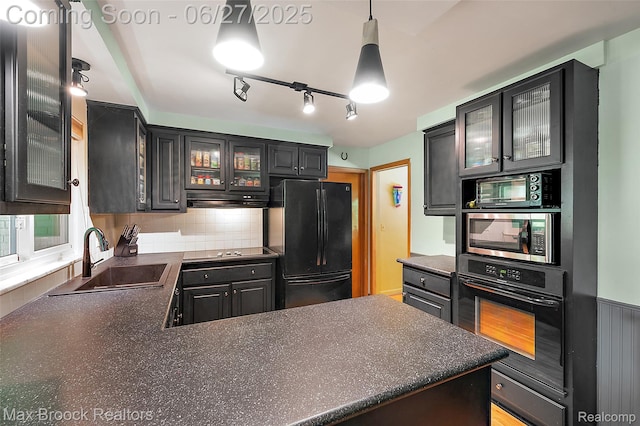 7189 Lindenmere Dr, Bloomfield Hills, MI 48301 - kitchen with black appliances, dark countertops, and decorative backsplash
