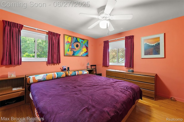 7189 Lindenmere Dr, Bloomfield Hills, MI 48301 - bedroom featuring multiple windows, wood finished floors, and ceiling fan