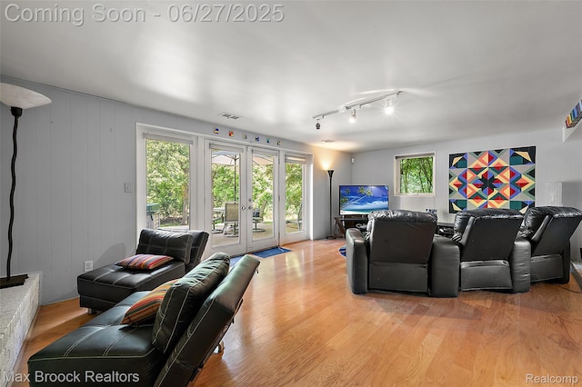 7189 Lindenmere Dr, Bloomfield Hills, MI 48301 - living area featuring french doors, light wood-type flooring, and track lighting