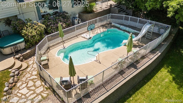 7189 Lindenmere Dr, Bloomfield Hills, MI 48301 - view of swimming pool featuring stairs, a water slide, and a patio
