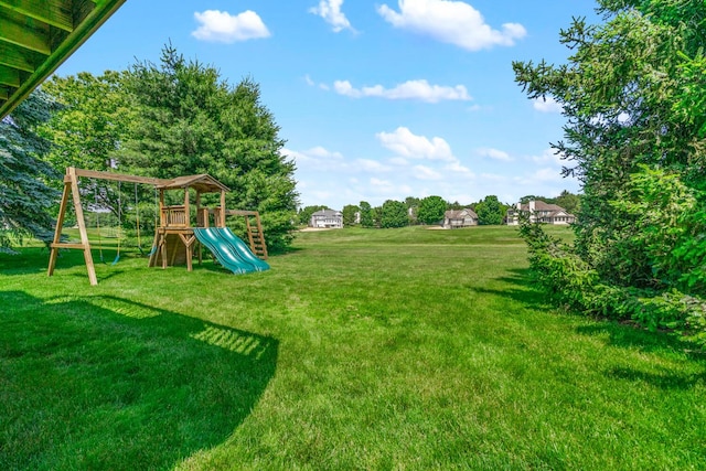 7639 Dunross Dr, Portage, MI 49024 - view of grassy yard featuring a playground